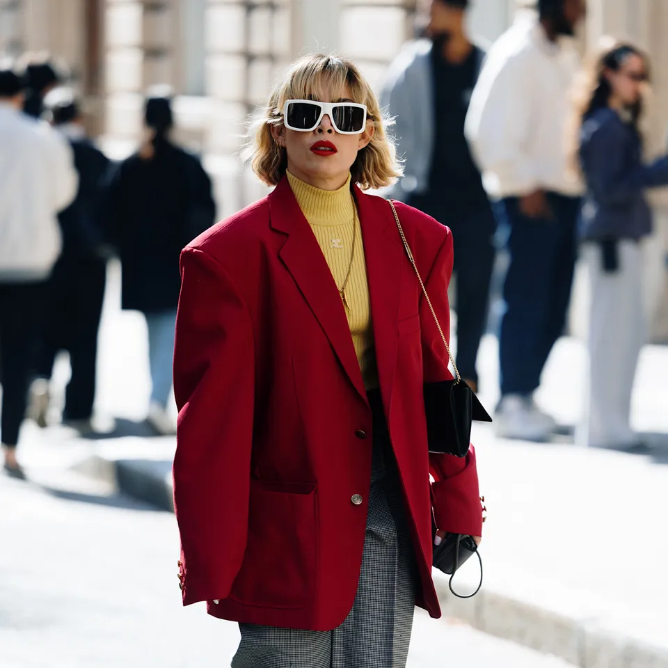 A lady on a blazer with straight-leg trousers on a polished looks 

