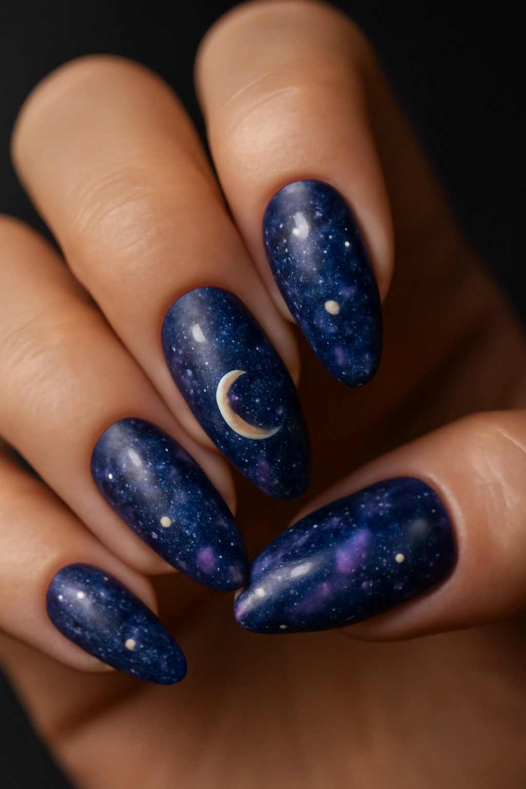 Almond nails with stars and moons celestial design