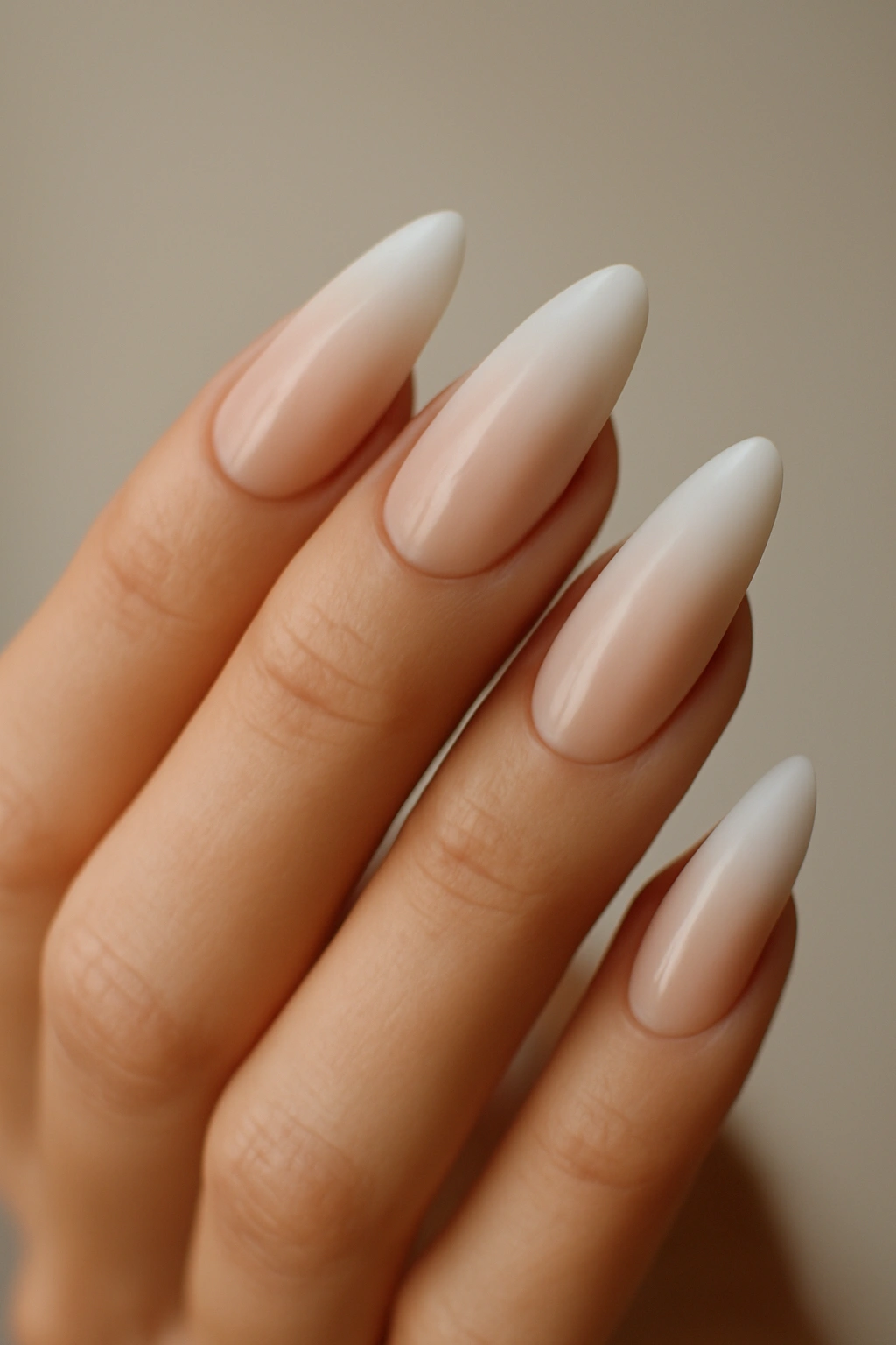 Close-up of Ombre Almond Nails showing nude-to-white gradient