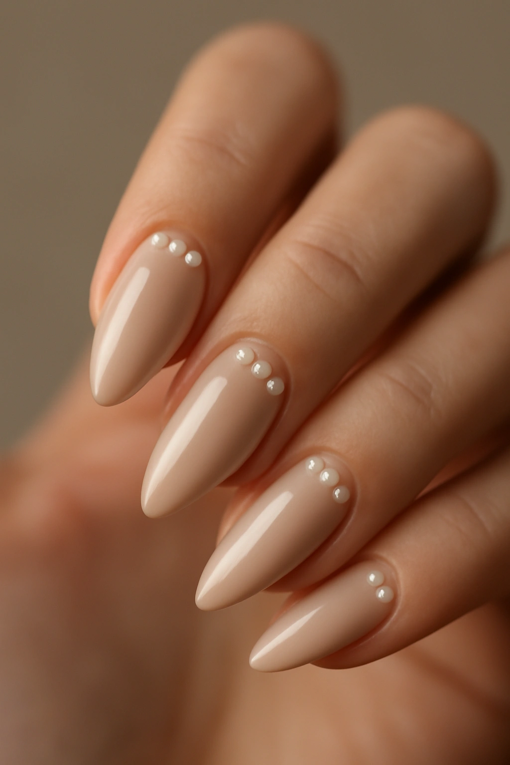 Almond nails with pearl inlays near the cuticle