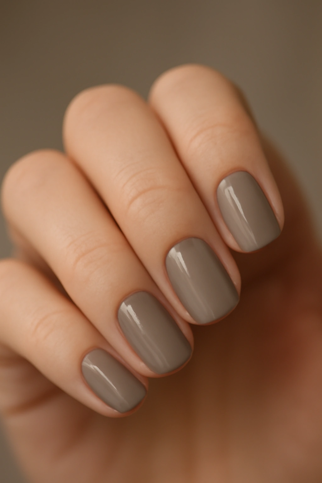 Close-up of nails in taupe greige tones with natural look